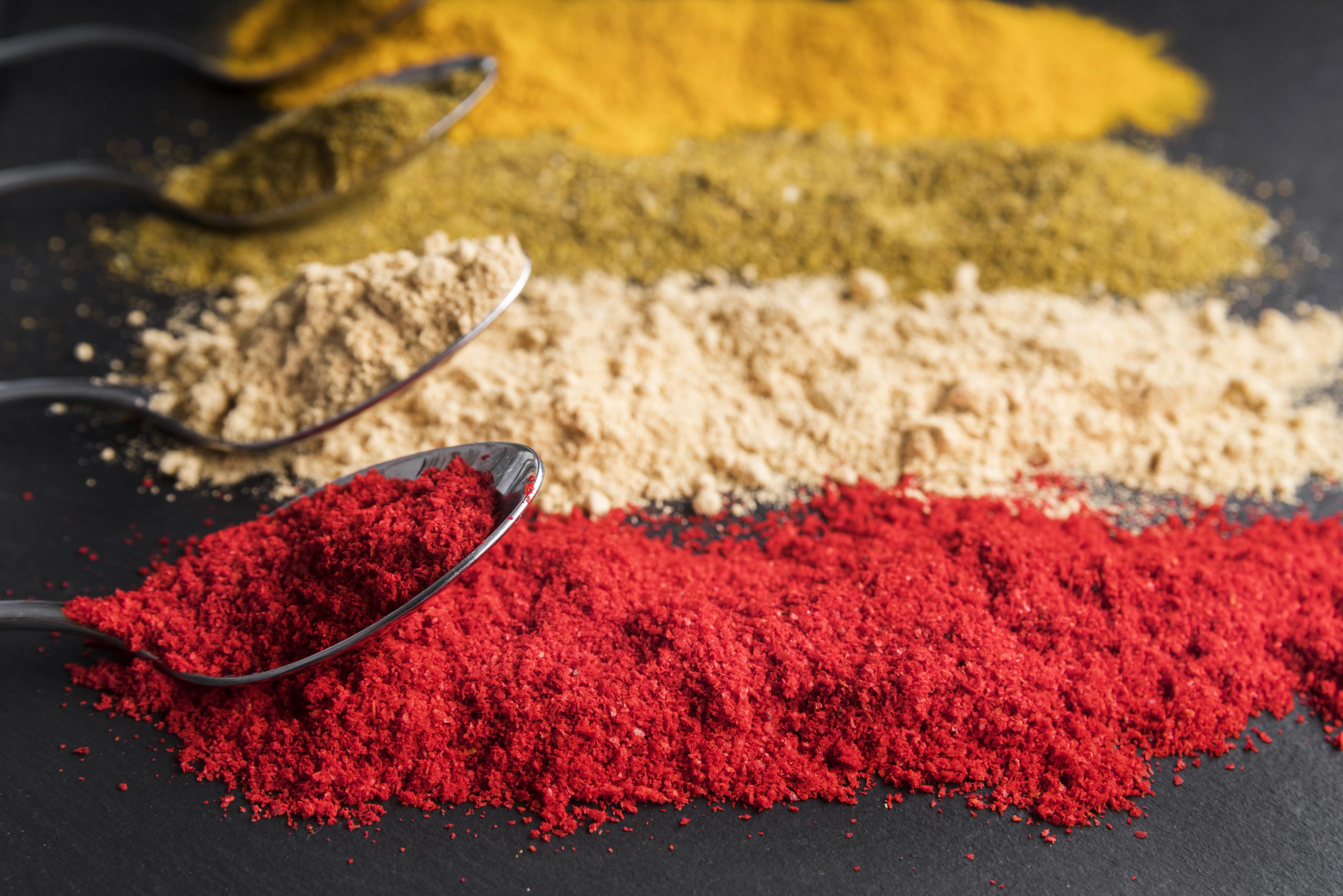 high-angle-spoons-with-colorful-powder
